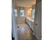 Bathroom with white cabinets, dual vanity and tiled floor at 105 Marchmont Dr, Locust Grove, GA 30248