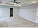 Spacious main bedroom with gray walls, carpet and ceiling fan at 105 Marchmont Dr, Locust Grove, GA 30248