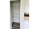 Walk-in pantry with adjustable wire shelving offering ample storage space for all your kitchen needs at 105 Marchmont Dr, Locust Grove, GA 30248