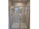 Bathroom's glass-enclosed shower features tiled walls at 105 Marchmont Dr, Locust Grove, GA 30248