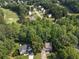 Aerial view of homes nestled in a lush, green area with nearby golf course at 14 Augusta Way, Hiram, GA 30141