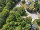 An aerial view of a neighborhood, surrounded by lush trees and greenery at 14 Augusta Way, Hiram, GA 30141