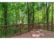 Exterior view of wood back deck surrounded by forest at 14 Augusta Way, Hiram, GA 30141
