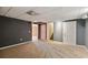 Basement area featuring neutral carpet, gray walls, and multiple doorways leading to other spaces at 14 Augusta Way, Hiram, GA 30141
