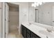 Dual-sink bathroom featuring a vanity with storage space and an adjacent toilet and shower at 14 Augusta Way, Hiram, GA 30141