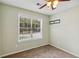 Cozy bedroom features a ceiling fan and a bright window view with neutral paint that offers calm at 14 Augusta Way, Hiram, GA 30141
