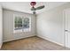 Neutral painted bedroom provides a ceiling fan and window with ample light and cozy atmosphere at 14 Augusta Way, Hiram, GA 30141