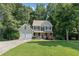 Charming two-story home with a well-manicured lawn, two-car garage, and a welcoming front porch at 14 Augusta Way, Hiram, GA 30141
