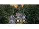 Charming two-story home with a well-manicured lawn, two-car garage, and a welcoming front porch at 14 Augusta Way, Hiram, GA 30141