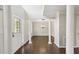 Spacious foyer with hardwood floors, decorative columns, and paneled dining room at 14 Augusta Way, Hiram, GA 30141