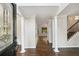 Elegant foyer featuring hardwood floors, white columns, and detailed trim work, creating a grand entrance at 14 Augusta Way, Hiram, GA 30141