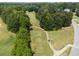 Picturesque golf course with winding paths, tree-lined fairways and manicured greens at 14 Augusta Way, Hiram, GA 30141