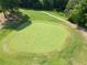 Aerial view of a well-maintained golf course with a green and manicured landscaping at 14 Augusta Way, Hiram, GA 30141