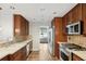 Kitchen featuring stainless steel appliances, tile backsplash, and hardwood floors at 14 Augusta Way, Hiram, GA 30141