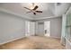 Expansive main bedroom boasts tray ceilings, neutral walls and transitions into an attached bathroom at 14 Augusta Way, Hiram, GA 30141
