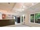 Recreation room with a wet bar, tile flooring, and bright windows overlooking the backyard at 14 Augusta Way, Hiram, GA 30141