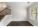 Hall with hardwood floors, staircase, and view of the outdoors at 14 Augusta Way, Hiram, GA 30141