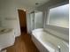Main bathroom featuring a shower, bathtub and a single sink vanity at 2994 Abbotts Oak Way, Duluth, GA 30097
