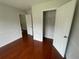 Bedroom with neutral walls and wood-look floors, showcasing a walk-in closet at 2994 Abbotts Oak Way, Duluth, GA 30097