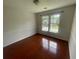 Bedroom with neutral walls, wood-look floors and a double window at 2994 Abbotts Oak Way, Duluth, GA 30097