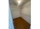 Walk-in closet featuring wire shelving and wood-look floors at 2994 Abbotts Oak Way, Duluth, GA 30097