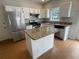 Functional kitchen with stainless steel appliances, granite countertops and an island at 2994 Abbotts Oak Way, Duluth, GA 30097