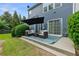 Cozy backyard patio with comfortable seating, perfect for outdoor relaxation at 110 Finchley Dr, Roswell, GA 30076