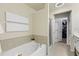 Relaxing bathroom with a soaking tub and walk-in closet at 110 Finchley Dr, Roswell, GA 30076
