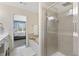 Bright bathroom with double sinks, separate shower, and soaking tub with a view to the bedroom at 110 Finchley Dr, Roswell, GA 30076