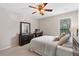 Well-lit bedroom featuring neutral tones and comfortable furnishings at 110 Finchley Dr, Roswell, GA 30076