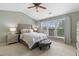Comfortable bedroom with large windows offering scenic views and a stylish sitting area at 110 Finchley Dr, Roswell, GA 30076