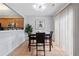 Inviting dining area featuring modern lighting, hardwood floors, and a view into the kitchen at 110 Finchley Dr, Roswell, GA 30076