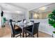 Open concept dining area with hardwood floors, a modern light fixture and easy access to the kitchen at 110 Finchley Dr, Roswell, GA 30076