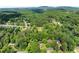 An elevated view displays a neighborhood community surrounded by lush landscape at 2751 Pilgrim Mill Rd, Cumming, GA 30041