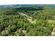 An elevated view displays a neighborhood community surrounded by lush landscape at 2751 Pilgrim Mill Rd, Cumming, GA 30041