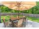 Spacious back patio with a dining table and chairs at 2751 Pilgrim Mill Rd, Cumming, GA 30041