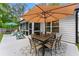 Back patio featuring a dining table and lounge seating at 2751 Pilgrim Mill Rd, Cumming, GA 30041