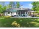Well-maintained backyard featuring a screened in porch and patio, great for relaxing and entertaining at 2751 Pilgrim Mill Rd, Cumming, GA 30041