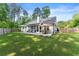Expansive backyard featuring a patio perfect for outdoor seating and entertaining at 2751 Pilgrim Mill Rd, Cumming, GA 30041