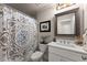 Full bathroom with a shower-tub combination, white vanity, and decorative mirror at 2751 Pilgrim Mill Rd, Cumming, GA 30041