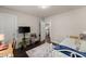 Well-lit bedroom featuring a daybed, TV, and plant at 2751 Pilgrim Mill Rd, Cumming, GA 30041