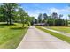 Long driveway leading to a lovely home surrounded by mature trees and greenery at 2751 Pilgrim Mill Rd, Cumming, GA 30041