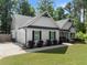 Beautiful home featuring a side entry garage, black trimmed windows and stylish landscaping at 2751 Pilgrim Mill Rd, Cumming, GA 30041