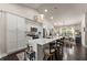 Bright kitchen with white cabinets, a large island with seating, and stainless steel appliances at 2751 Pilgrim Mill Rd, Cumming, GA 30041