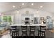 Well-lit kitchen featuring a large island with seating, stainless steel appliances, and ample counter space at 2751 Pilgrim Mill Rd, Cumming, GA 30041