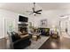 Comfortable living room with fireplace, ceiling fan, and open floor plan at 2751 Pilgrim Mill Rd, Cumming, GA 30041