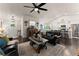 Open-concept living room with dark hardwood floors, ceiling fan and plenty of natural light at 2751 Pilgrim Mill Rd, Cumming, GA 30041