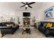 Bright living room with fireplace, stylish decor, and abundant natural light at 2751 Pilgrim Mill Rd, Cumming, GA 30041