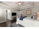 Well-lit main bedroom featuring a tray ceiling and hardwood floors at 2751 Pilgrim Mill Rd, Cumming, GA 30041