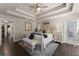 Spacious main bedroom with tray ceilings, french doors, and lots of natural light at 2751 Pilgrim Mill Rd, Cumming, GA 30041